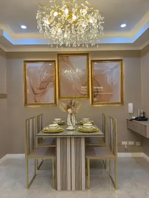 a dining room with a table and a chandelier at Pure Elegance 1BR Suite in Manila