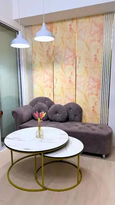 a living room with a couch and a table at Azure Urban Resort Residences, 1BR Bahamas 15th floor in Manila