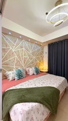 a bedroom with a large bed with pillows on it at Azure Urban Resort Residences, 1BR Bahamas 15th floor in Manila
