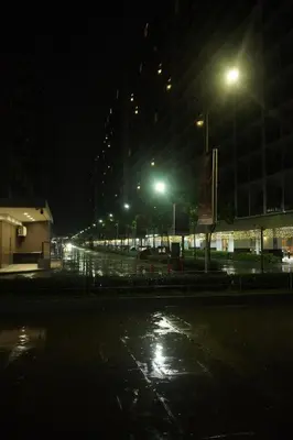 a city street at night with street lights at City View Near MOA & NAIA with PS4, Wi-Fi, Netflix in Manila