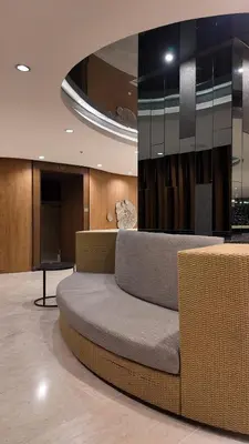 a couch sitting in a room in a building at City View Near MOA & NAIA with PS4, Wi-Fi, Netflix in Manila