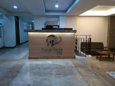 a lobby with a sign for a salsa verde club at Paseo Verde in Manila