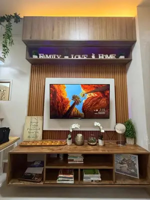 a living room with a flat screen tv on a wall at Shore Bliss Staycation by Aims in Manila