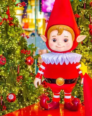 a elf doll standing in front of a christmas tree at RM A837 S Residence near SMX and SM Arena in Manila