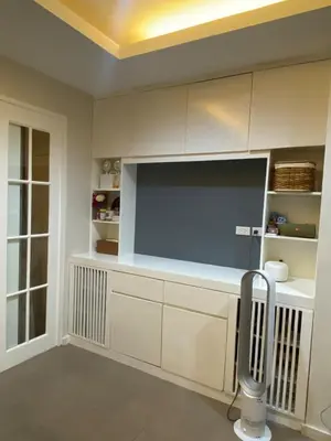 a living room with a large flat screen tv at Affordable, Cozy & Quiet 1BR in BGC - Ideal for Short & Long Stays in Manila