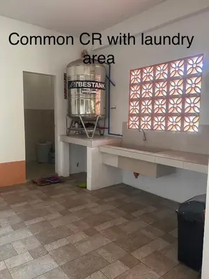 a room with a room with a window and a floor at Jarens Diner in Silang