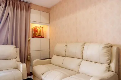 a living room with a couch and two chairs at Classic-style Top Floor In Manila Bay in Manila