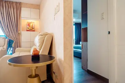 a hotel room with a table and a room at Classic-style Top Floor In Manila Bay in Manila