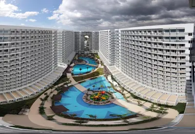 an aerial view of two large white buildings at Shell Residences Condo in Manila