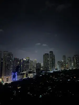a city lit up at night with buildings at Top-Floor Studio in Makati with City Views Good For 2-3 Pax in Manila