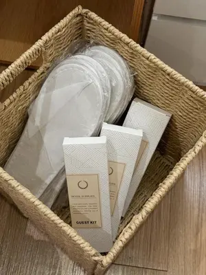 a basket with a bottle and other items in it at Top-Floor Studio in Makati with City Views Good For 2-3 Pax in Manila