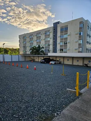 a parking lot with orange cones in front of a building at Your Cozy Space in Stanford Suites 3 Brgy Inchican Silang Cavite in Silang