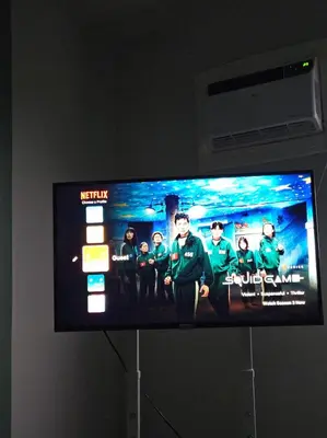 a television screen with a group of people on it at Your Cozy Space in Stanford Suites 3 Brgy Inchican Silang Cavite in Silang