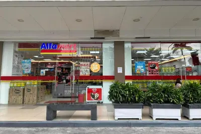 a store front with a bench in front of it at Mall of Asia Staycation, located in Shore Residences Pasay Manila near Manila Airport in Manila
