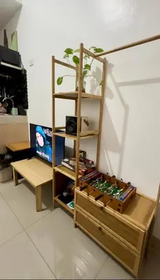 a book shelf with a bunch of beer cans at Ellain's Cozy Staycation-SMDC Green 2 Residences in Dasmariñas
