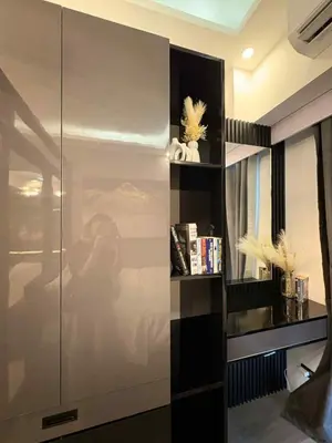 a room with a glass partition with a shelf at Cozy Escape with Golden Hour View Condo in Manila