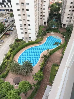 an overhead view of a swimming pool in a building at Stunning Pool and City View in Manila