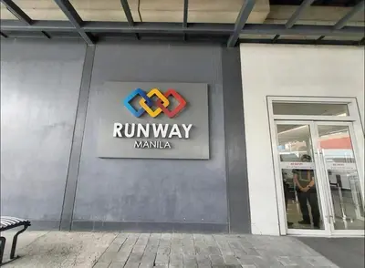 a run way sign on the side of a building at 1 Bedroom Apartment Condo Across Manila Airport NAIA T3 in Manila