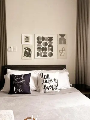 a bedroom with a bed with two pillows on it at BES Building in Dasmariñas