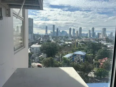 a view of a city skyline from a window at UDCT Condo Hotel in Manila in Manila