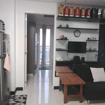 a living room with a couch and a table at Manila Skyview suite at Birch tower condo in Manila