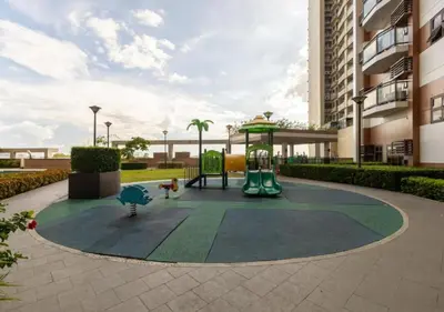 a playground in a courtyard of a building at Affordable 1BR Condo In Pasay with Balcony and Amenity View, Free Pool Fast WiFi Near NAIA Airport , MOA,PICC in Manila