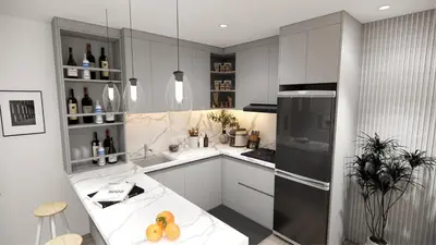 a kitchen with white cabinets and a refrigerator at Staycation by Carmen Romualdo in Manila
