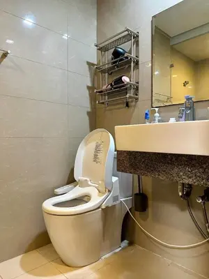a bathroom with a toilet and a sink at Condotels by ZJM Residence in Manila