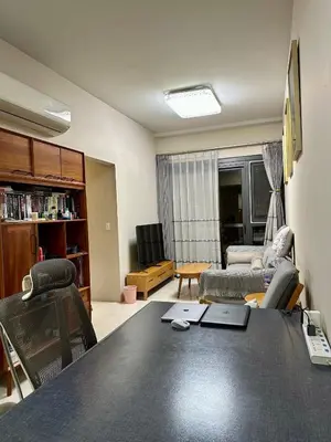 a living room with a table and a couch at Condotels by ZJM Residence in Manila