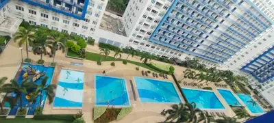 an aerial view of a resort with palm trees and buildings at Sea Residences Pasay City MOA by Jhayem in Manila