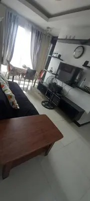 a living room with a couch and a table at Manila bay view condo birch tower in Manila
