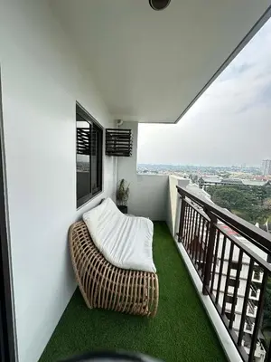 a balcony with a bean bag chair on the floor at Exquisite Property Stays at Acacia Estate Taguig City in Manila