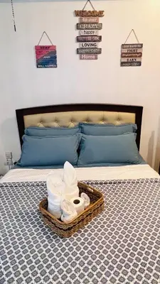a tray of towels and towels on a bed at D'Gonia Space in Manila