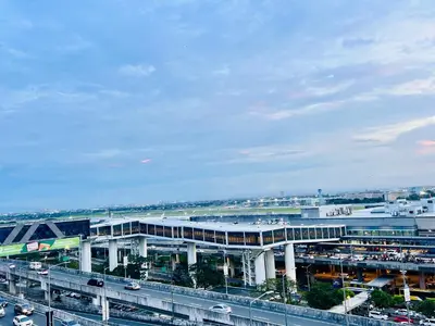 a large stadium with a bridge and a freeway at D'Gonia Space in Manila