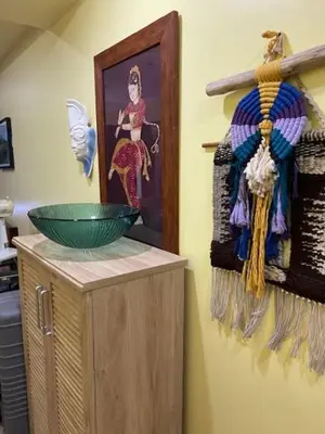 a kitchen with a bowl on top of a cabinet at South of Market Private Risidence in Manila