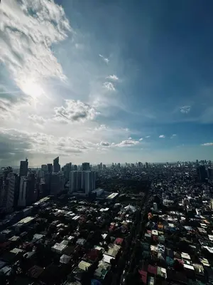 an aerial view of a large city with buildings at Reset at the Gramercy in Manila