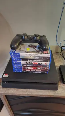 a stack of video game books on a table at Cozy Bian Getaway - Entire House for Rent in Biñan