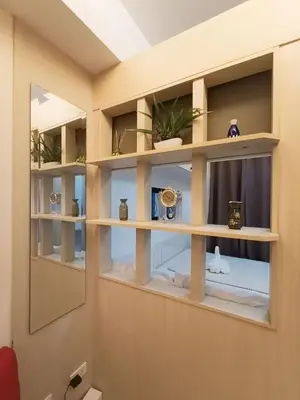 a room with shelves with vases and plants at Sea Residences Near MOA SMX Pasay City in Manila