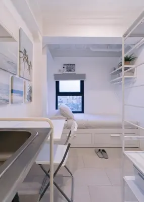 a hospital room with a bed and a sink at Canopy Agutaya BGC in Manila