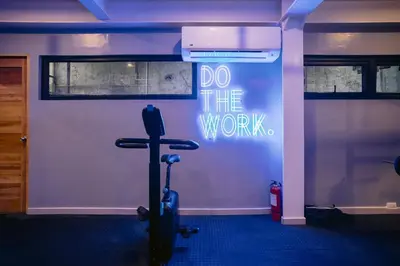 a gym with a sign that says do the work at Canopy Agutaya BGC in Manila