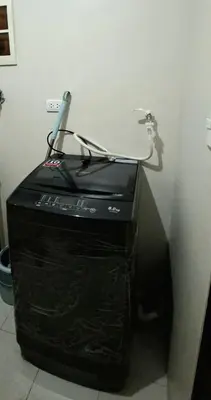 a black router with a cord on top of it at Cozy Modern 2 Bedroom 81 Newport Boulevard in Manila