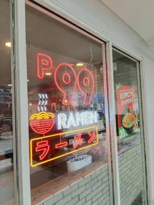 a neon sign in the window of a restaurant at Josh place Shell residence MOA in Manila