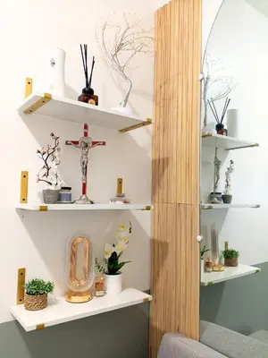 a room with shelves with plants and a cross at Haute Haven - 1br with Balcony in Manila