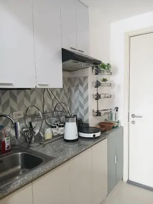 a kitchen with a sink and a counter top at Haute Haven - 1br with Balcony in Manila
