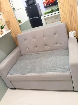 a couch in the corner of a room at Haute Haven - 1br with Balcony in Manila