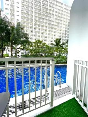 a balcony with a view of the pool at Direct Pool Access in Shore Residences near SM MOA in Manila