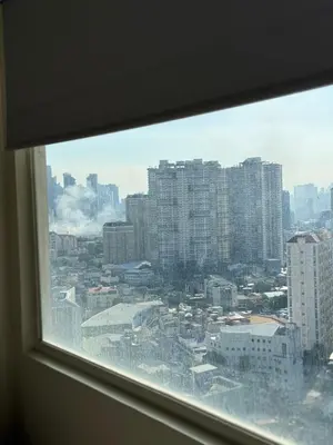 a view of a city from a window at AlRBNB Mandaluyong - by Jam Es in Manila