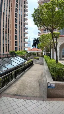 a walkway in the middle of a city with tall buildings at Canal View Luxury Stay, Studio type , Massage Chair, Office Desk in Manila