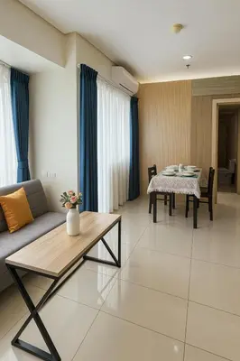 a living room with a couch and a table at SMDC BREEZE Manila Bay Sunset View in Manila