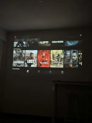 a television screen with movies on it in a room at Cozy Condo for Relaxing Stays & Movie Nights in Imus